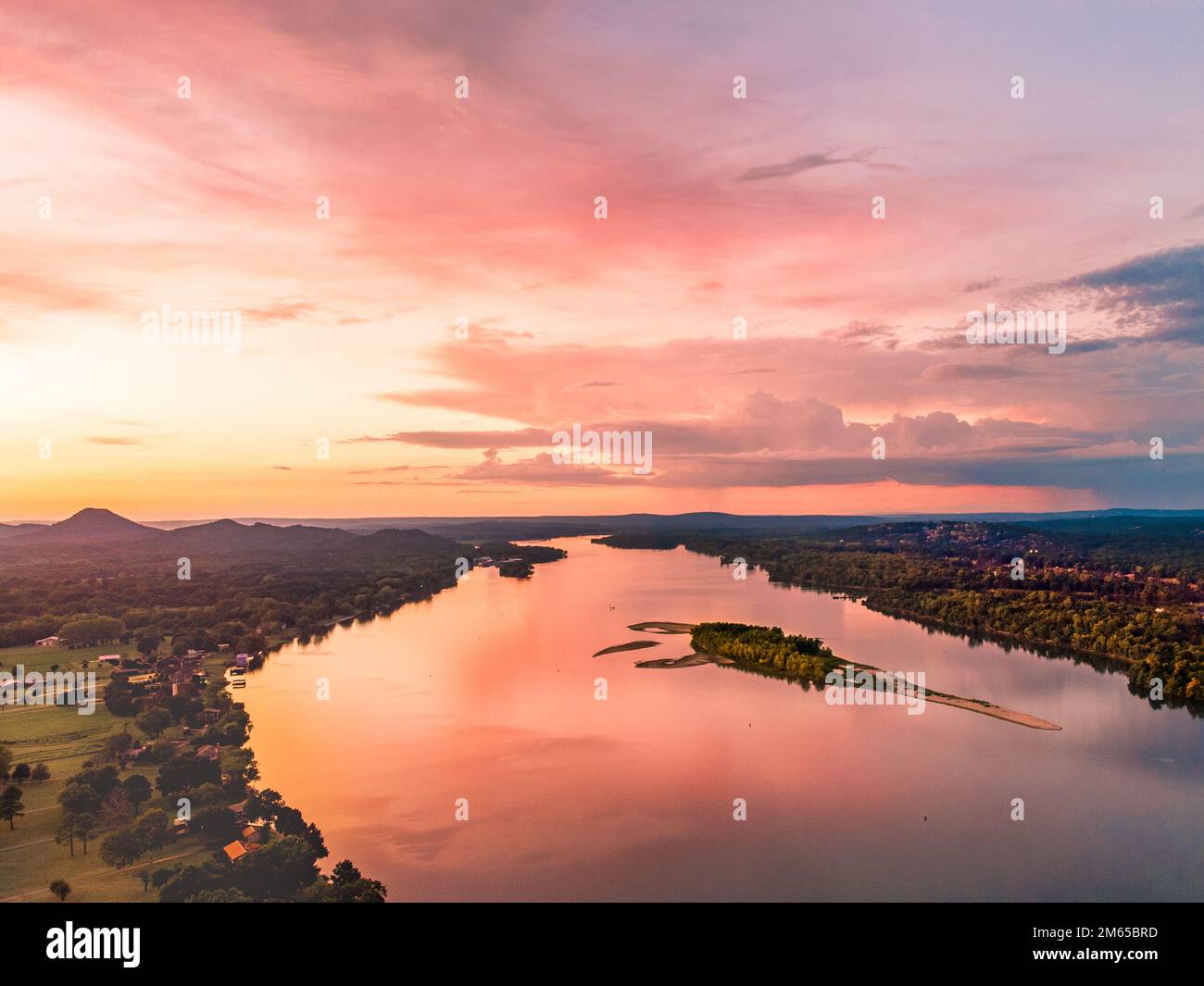 A scenic sunset over a river Stock Photo - Alamy