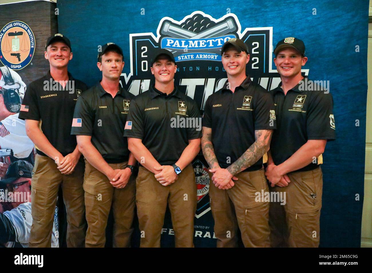 Members from the U.S. Army Marksmanship Unit Action Shooting Team pose for a photo during the