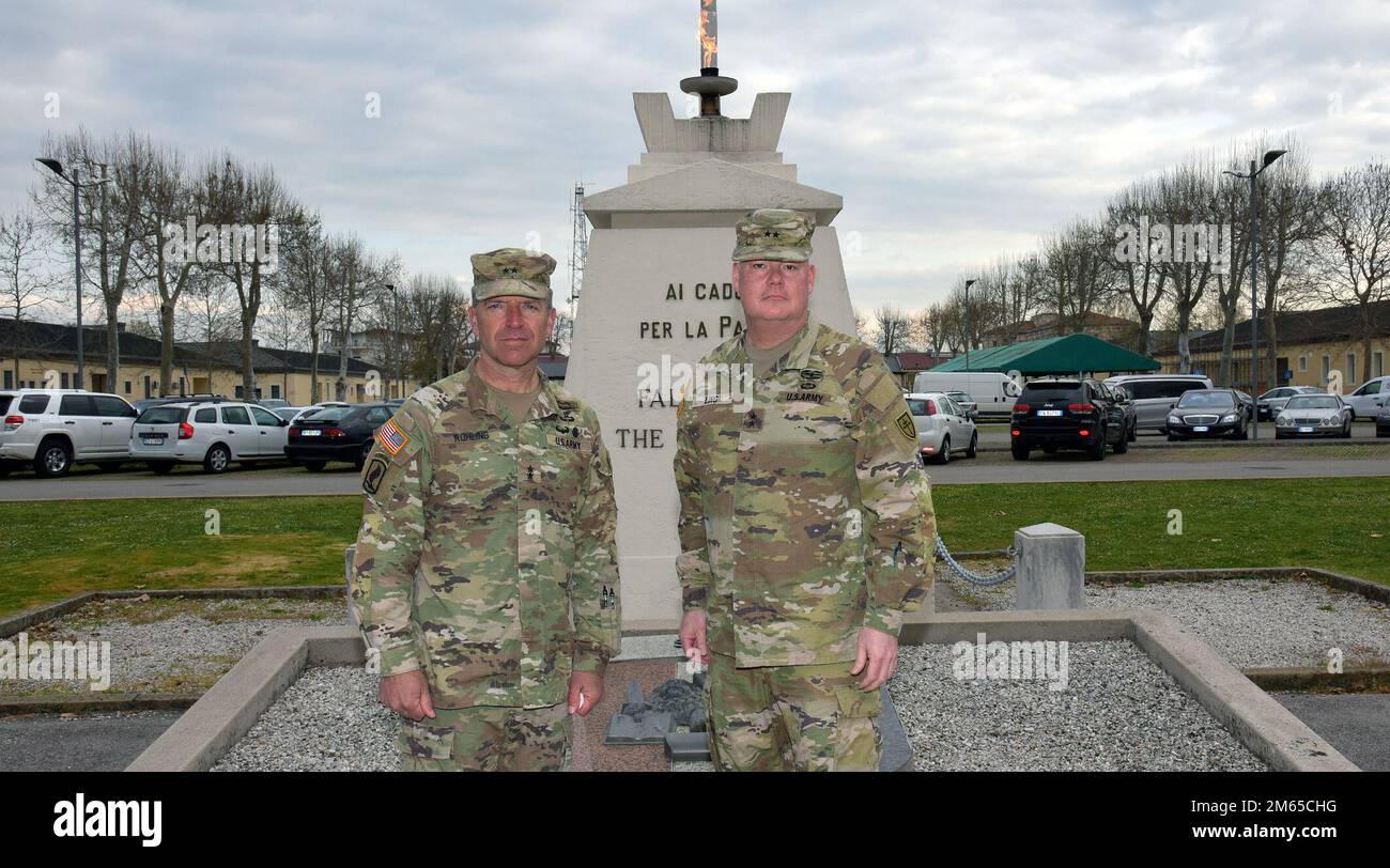 Maj. Gen. David W. Ling, the 79th Theater Sustainment Command commanding general, right, and Maj. Gen. Andrew M. Rohling, the U.S. Army Southern European Task Force, Africa commander, meet in front of the Eternal Flame memorial on Caserma Ederle during Ling’s visit to Vicenza, Italy, Apr. 4, 2022. Stock Photo