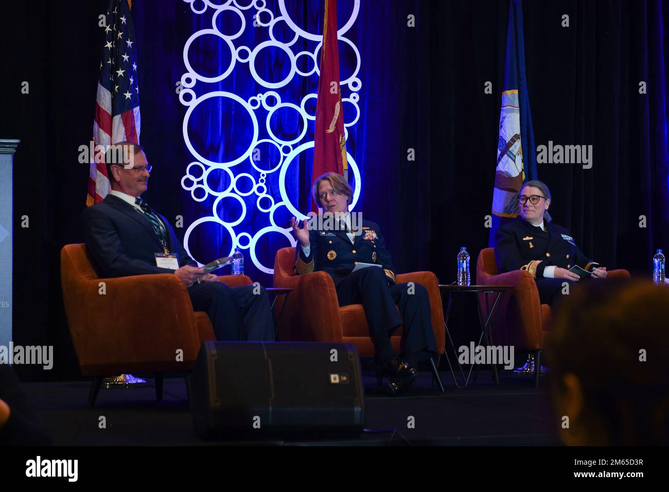 NATIONAL HARBOR, Md. (April 4, 2022) Adm. Linda Fagan, Vice Commandant, U.S. Coast Guard, talks about safeguarding international law in the Arctic with  Major General Randy Kee, U.S. Department of Defense Senior Advisor of Arctic Security Affairs, (left), and Rear Adm. Ewa Skoog Haslum, Chief of Navy, Swedish Navy, (right), at “The Geostrategic Importance of the Arctic” panel during the Sea-Air-Space Exposition. The Sea-Air-Space Exposition is an annual event that brings together key military decision makers, the U.S. defense industrial base and private-sector U.S. companies for an innovative Stock Photo