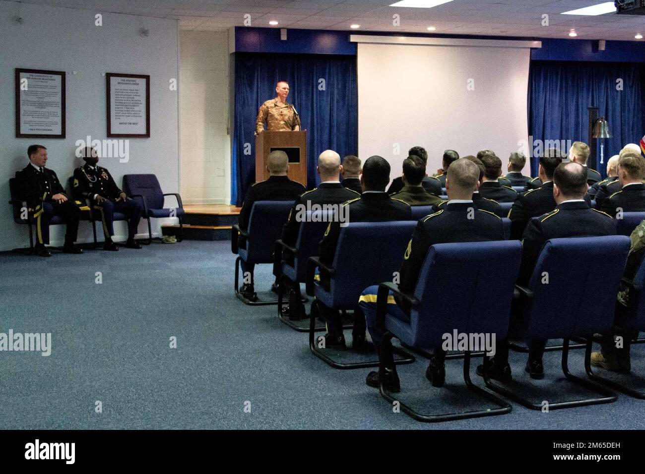 U.S. Army Soldiers commemorate completing the Advance Leaders Course April 4, 2022 at the U.S. Army Aviation Center of Excellence Noncommissioned Officer Academy at Fort Eustis, Virginia. Stock Photo