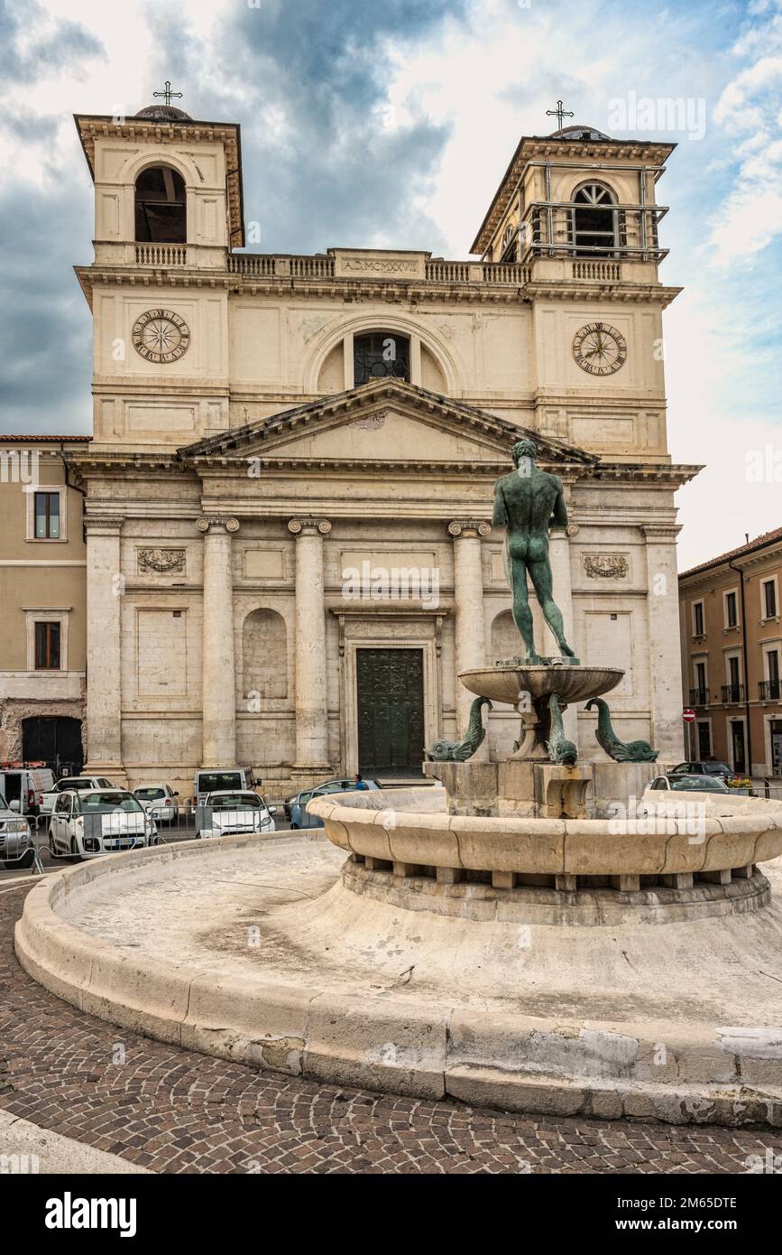 The Cathedral of San Massimo, Cathedral of the city of L'Aquila, restored after the earthquake and the old fountain at the foot of the square. Abruzzo Stock Photo