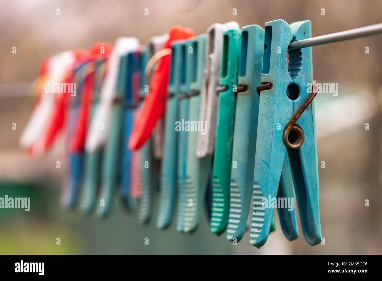 Clothespins and Clothes line on blur background, Stock Photo