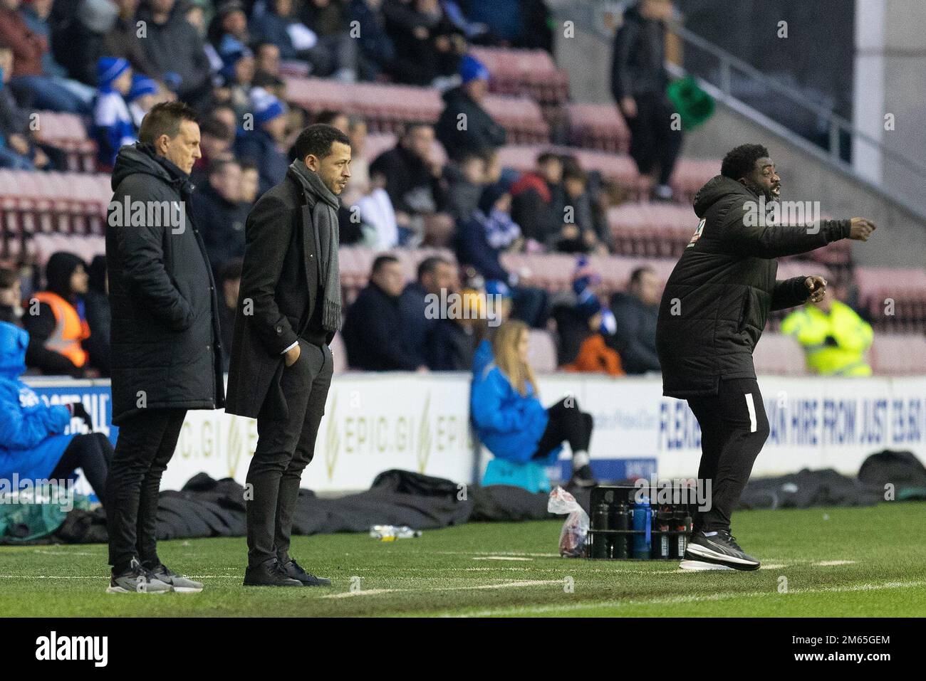 Wigan, UK. 02nd Jan, 2023. Liam Rosenior Manager of Hull City watches on whilst Kolo Toure Manager of Wigan Athletic gives his team instructions during the Sky Bet Championship match Wigan Athletic vs Hull City at DW Stadium, Wigan, United Kingdom, 2nd January 2023 (Photo by Phil Bryan/News Images) in Wigan, United Kingdom on 1/2/2023. (Photo by Phil Bryan/News Images/Sipa USA) Credit: Sipa USA/Alamy Live News Stock Photo