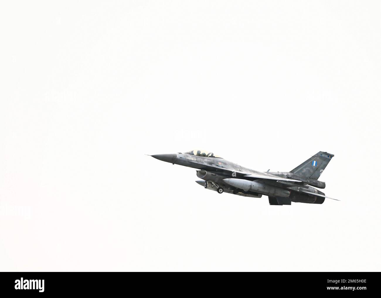 A Hellenic air force F-16 takes off April 4, 2022, at Andravida Air Base, Greece. The U.S., Cyprus, France, Israel, Romania, Italy, Slovenia, Austria and Canada supported and participate in the multinational exercise, INIOCHOS 22, a Hellenic air force-led operational and tactical level field training exercise, hosted by the Hellenic Air Tactics Center at Greece’s fighter weapons school. Stock Photo