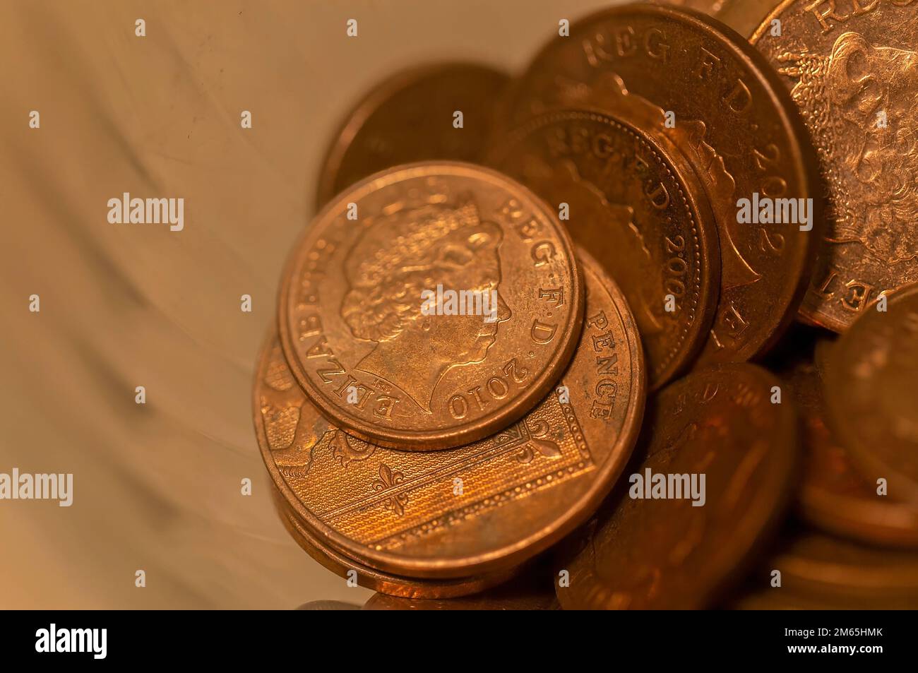 Spare change, British money. Currency of the United Kingdom containing the Queens image Stock Photo