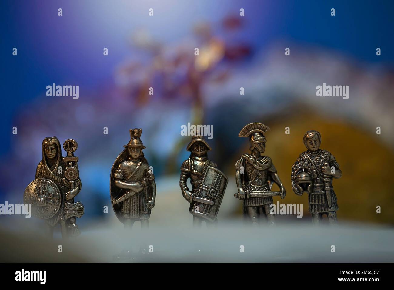 Roman soldier figurines.Small metal warrior figurines posed in small cinematic scenes.Gladiator,pretorian,legionary,ensign and a Infantry officer. Stock Photo