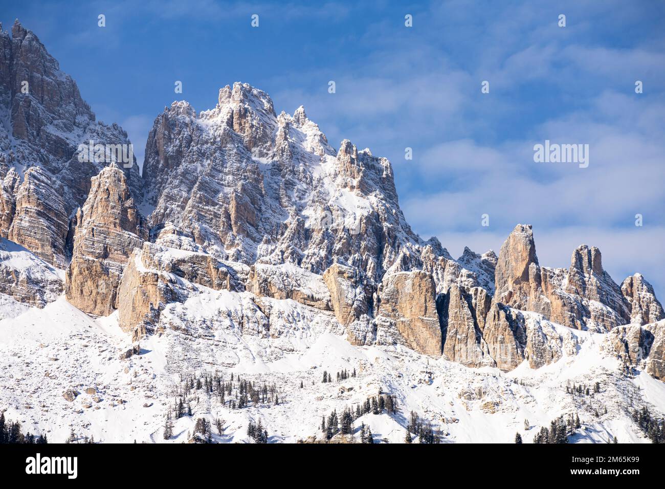 the peaks of the Dolomites mountains in the snow covered Italian alps ...