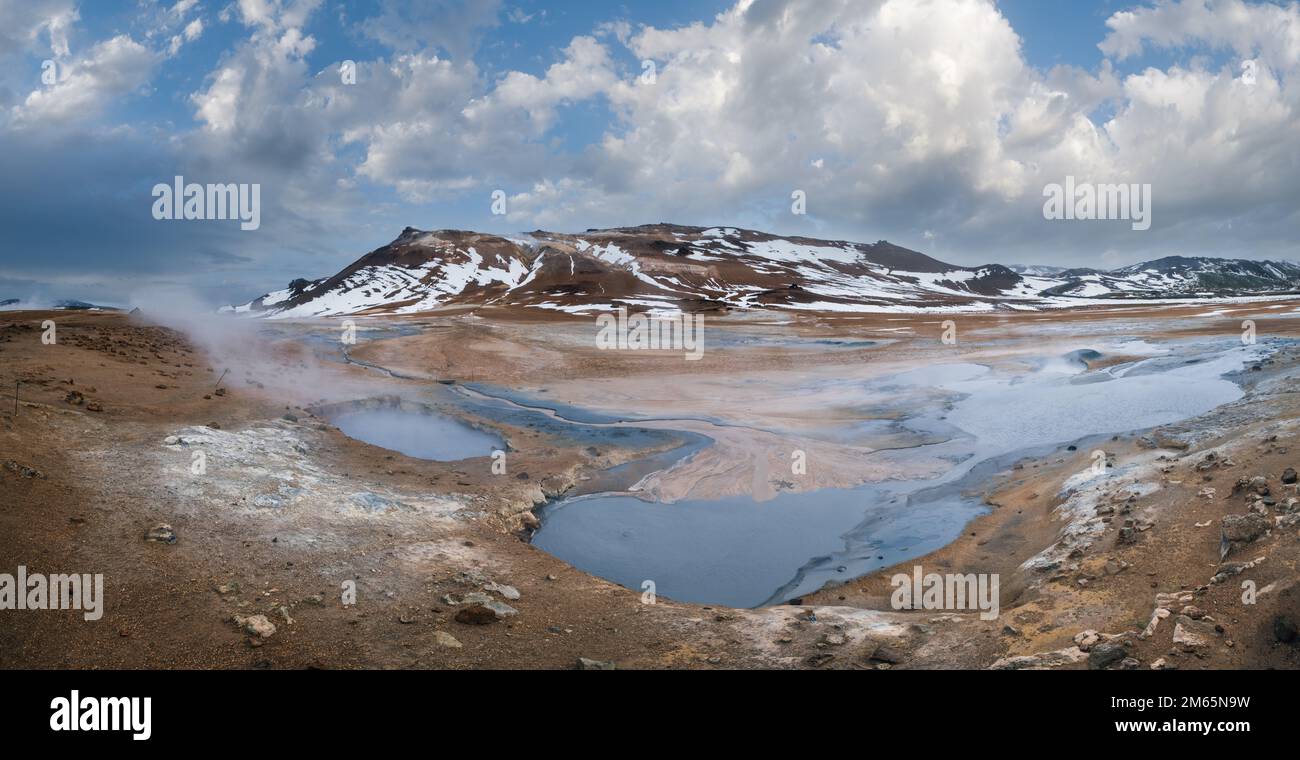 The Namafjall Geothermal Area, Iceland, on the east side of Lake Myvatn. At this area, also known as Hverir, are many smoking fumaroles, boiling mud p Stock Photo