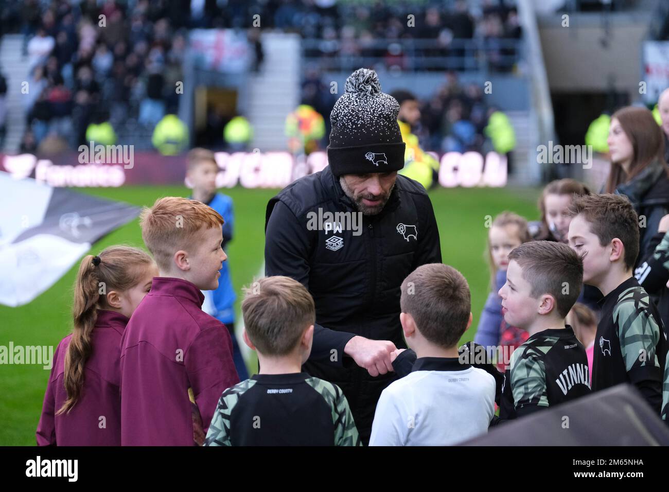 Pride Park, Derby, Derbyshire, UK. 2nd Jan, 2023. League One Football, Derby County versus Accrington Stanley; Derby Manager Paul Warne chatting to the Derby mascots ahead of the game Credit: Action Plus Sports/Alamy Live News Stock Photo