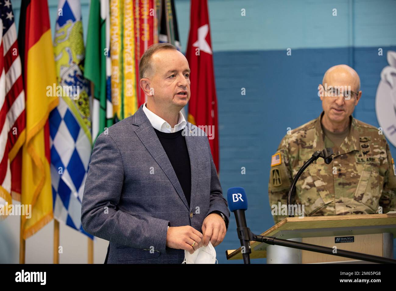 ANSBACH, Germany - Lord Mayor Thomas Deffner, lord mayor of the city of Ansbach, addresses the press during a press conference in Ansbach after a welcome ceremony at Barton Barracks in Ansbach, Germany, Tuesday, April 5. During the ceremony, the V Corps headquarters and the headquarters and headquarters battalion uncased their colors at their temporary home. The presence of the entire Victory Corps headquarters in Europe expands U.S. Army Europe and Africa’s ability to command land forces in Europe and sends a strong message to our NATO allies and partners that the United States is committed t Stock Photo