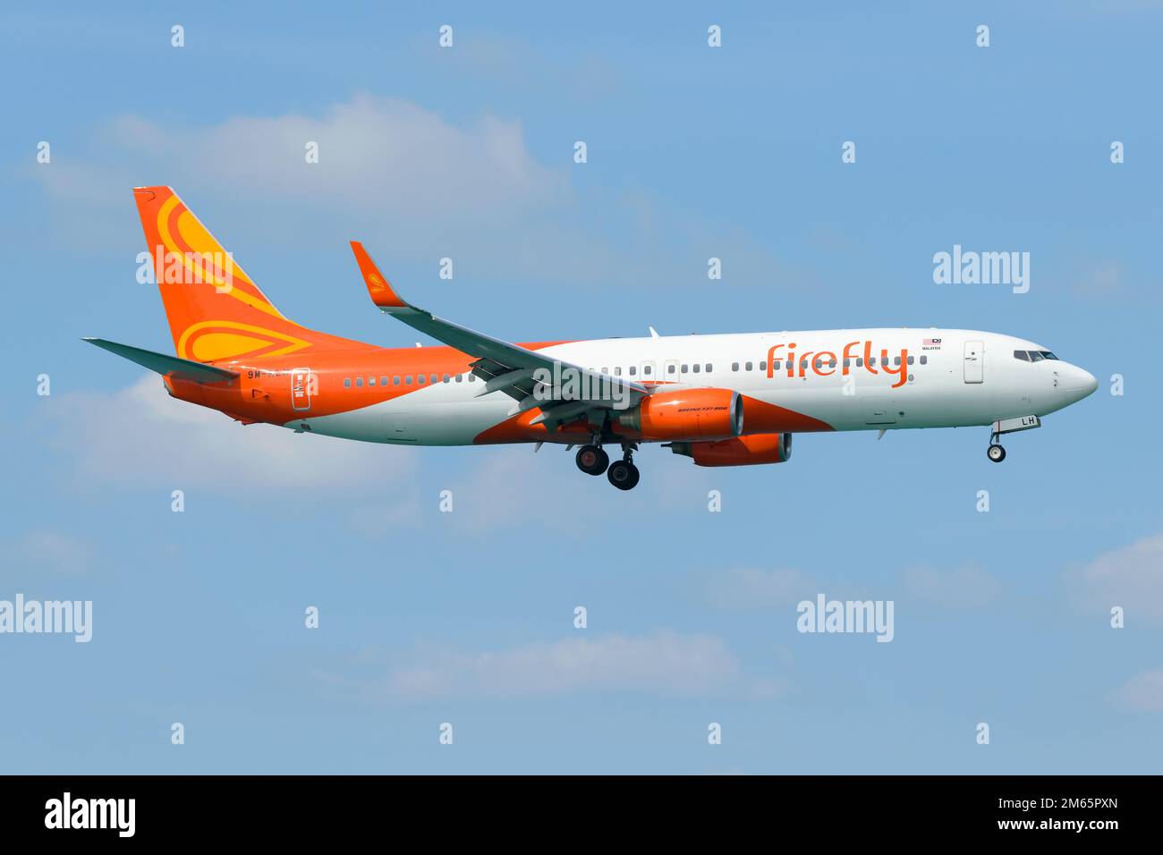 Firefly airline Boeing 737 aircraft flying. Airplane 737-800 of Firefly airline, also know as Fire Fly Airlines. Stock Photo