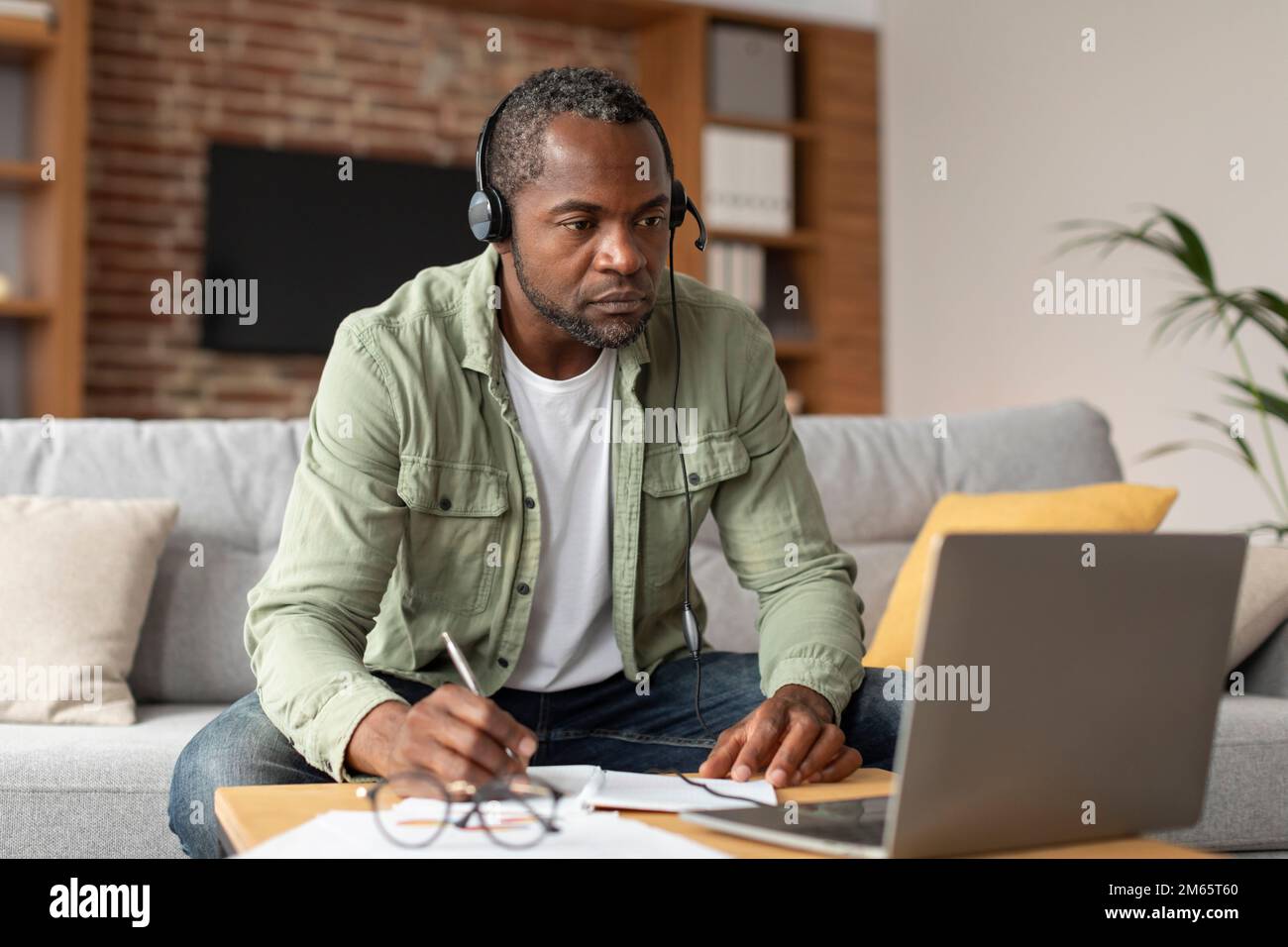 New normal and job remotely. Busy serious mature black male in ...