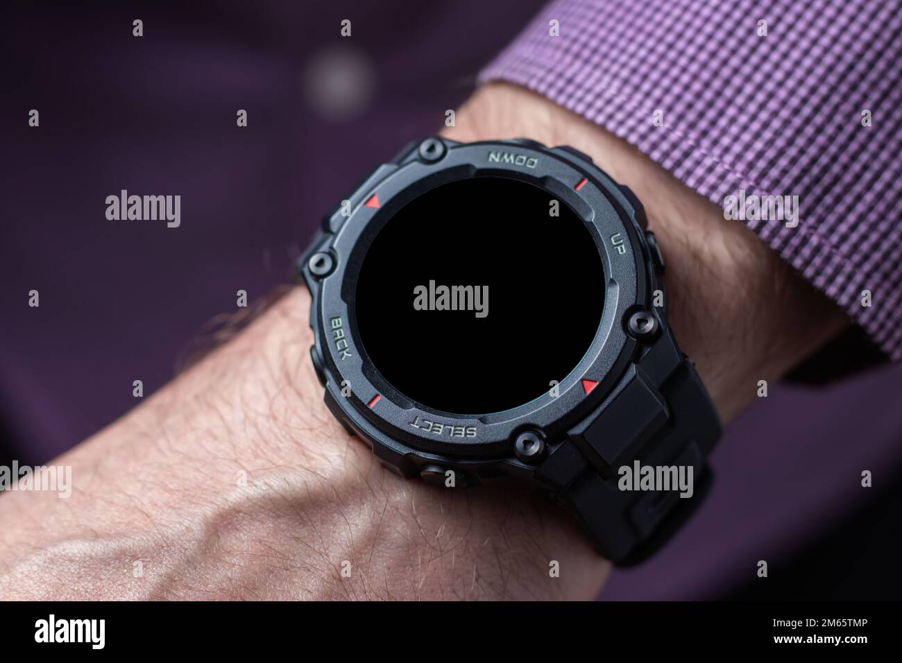 Hand of man wearing trendy smart watch. Modern gadget that lets you always stay connected to internet. Smart wrist watches Stock Photo