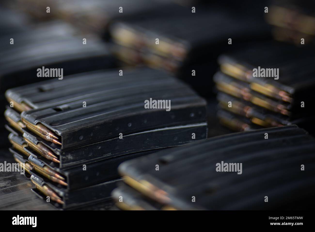 Magazines with 5.56mm ammunition sit on a table at the range during an
