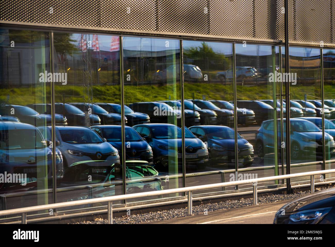 Gothenburg, Sweden July 30 2022 Long rows of cars at a car dealership mirrored in a glass