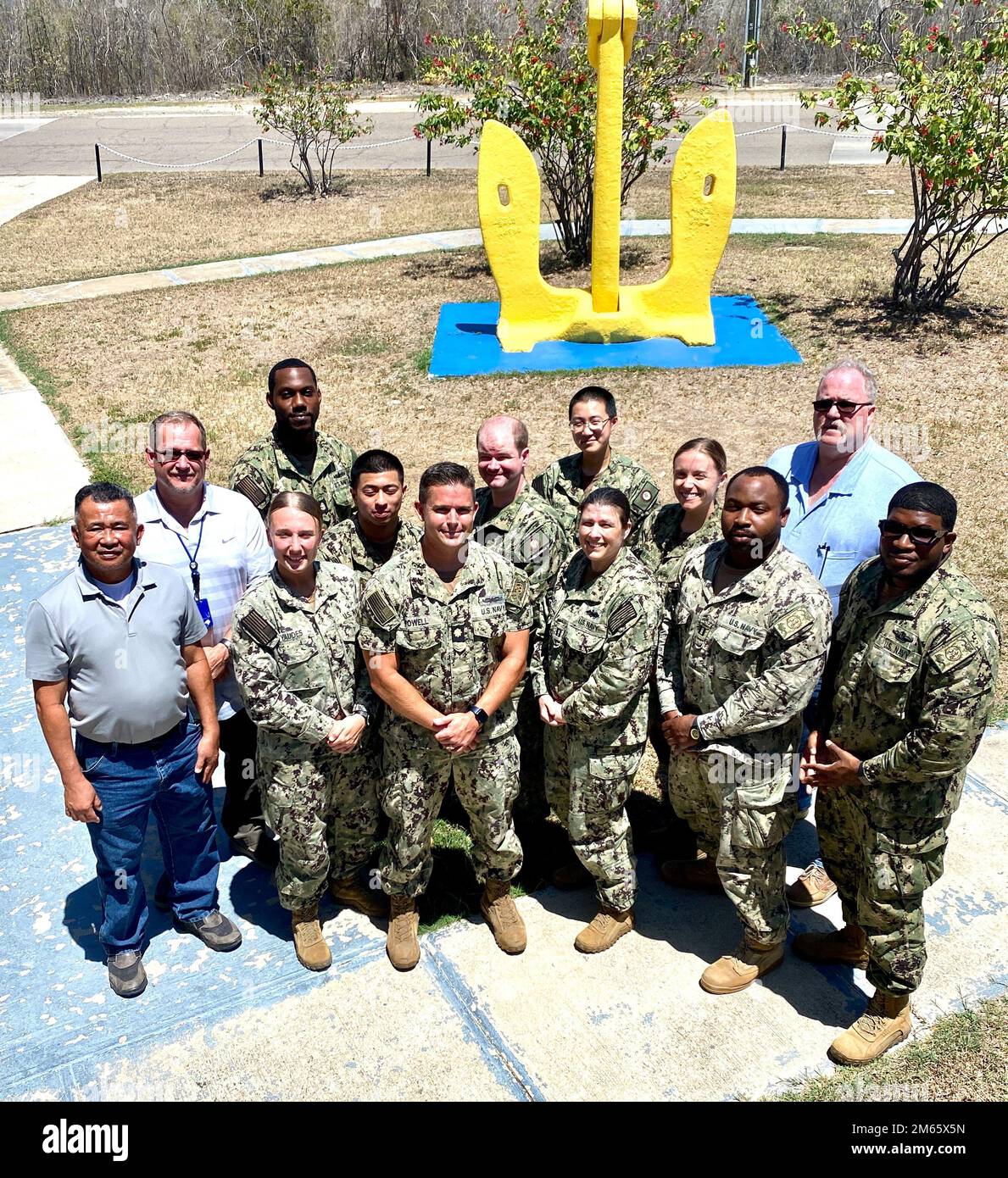 Members of the US NMRTC Guantanamo Bay Public Health Team and visiting Preventive Medicine team, temporarily assigned, pose for a picture in honor of  Public Health Week.   L to R back: Mr. Eduardo Mojica, Industrial Hygiene (IH); Mr. Todd Greenwood, Safety Manager; HMC James Bond, Preventive Medicine (PM); SN Tiahna Salahuddin, PM; Lt, Brennan, Navy Entomology Center of Excellence (NECE); Lt. Wong, NECE; Lt. Haley Barravecchia, Department Head, Preventive Medicine; Mr. George Smith, IH; L to R Front HN Jazmin Yaudes Navy Environmental and Preventive Medicine Unit, San Diego); Lt. Cmdr. Carl P Stock Photo