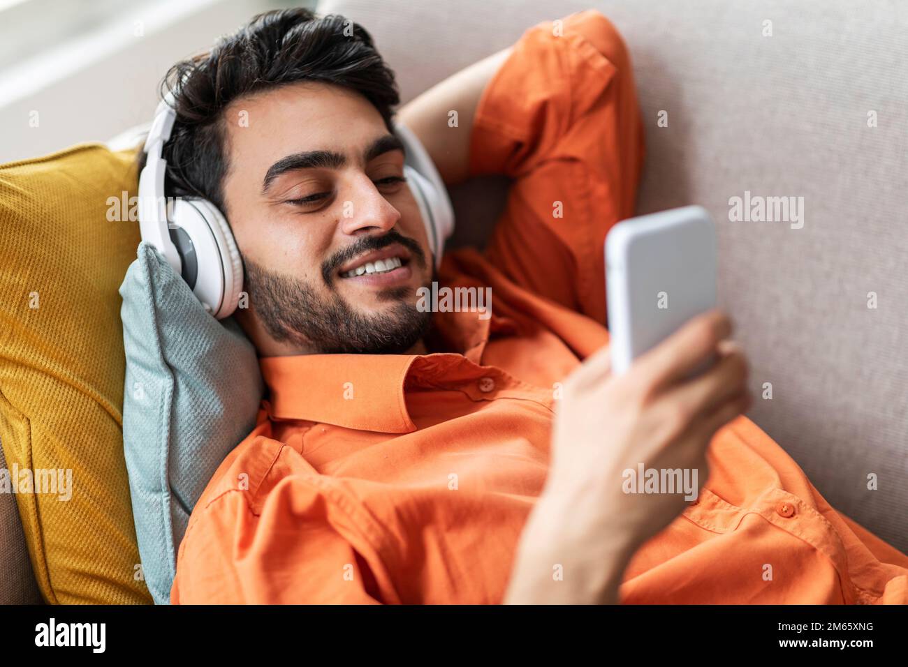 Candid man listening song hi-res stock photography and images - Alamy