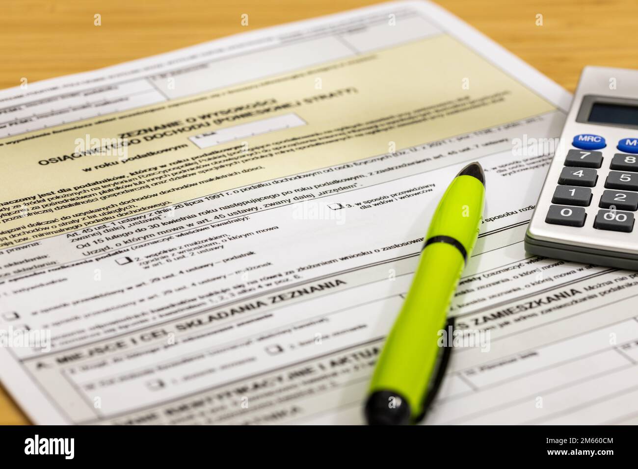 Settlement of annual tax in Poland, Calculator, pen and individual tax form Stock Photo