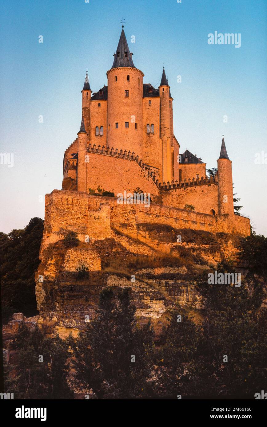 Segovia castle, view at sunset of the Alcazar of Segovia, a medieval castle-palace sited on a crag above the city of Segovia, Castile-Leon, Spain Stock Photo