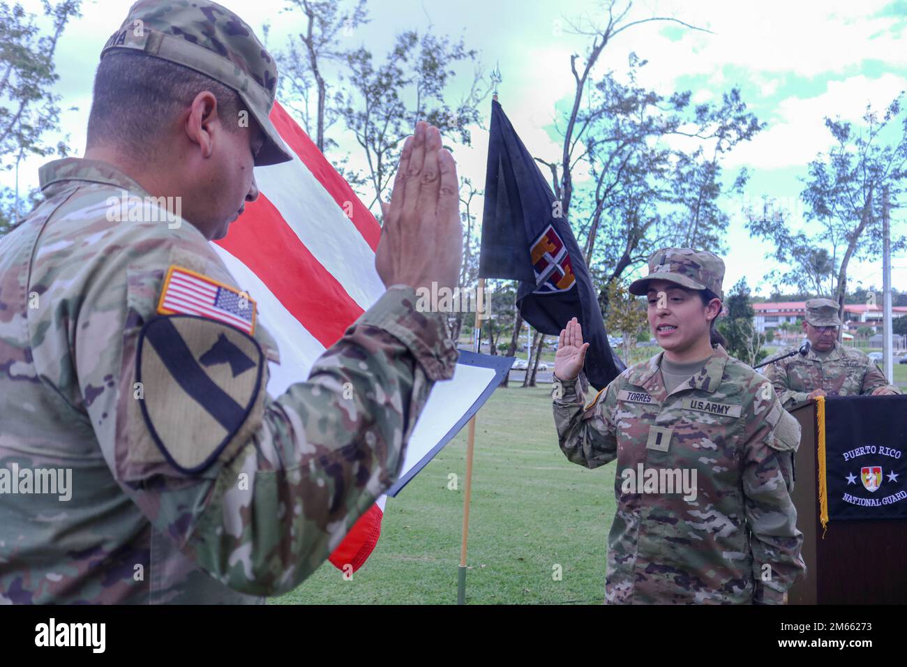Maj. Luis Medina, the officer in charge of Joint Task Force - Puerto Rico operation section (J3), re-administers the oath of office to 1st Lt. Karla Torres at Fort Buchanan, April 5, 2022. The U.S. Army and the Puerto Rico Army National Guard recognized Torres's qualities and potential and promoted her to 1st Lieutenant. Stock Photo