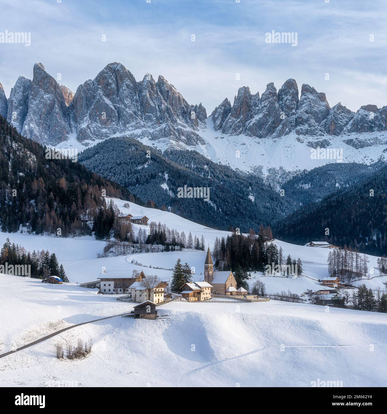 Snowy panorama at Santa Magdalena village in the famous Val di Funes. Trentino Alto Adige, Italy. Stock Photo