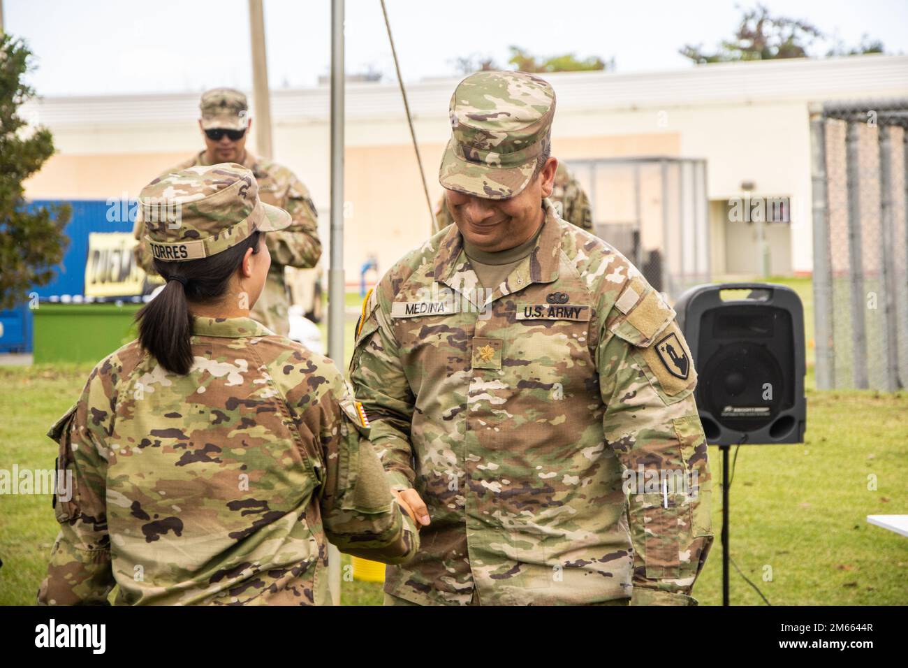 Maj. Luis E. Medina greets 1st Lt. Karla Torres after the re-administration of the oath office in Fort Buchanan, April 5, 2022. The U.S. Army and the Puerto Rico Army National Guard recognized Torres's qualities and potential and promoted her to 1st Lieutenant. Stock Photo