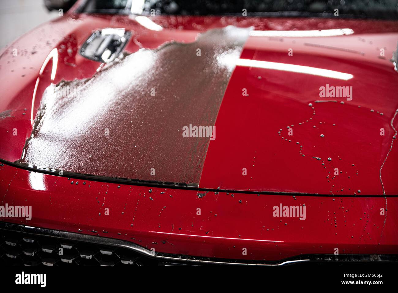 Effect after applying a ceramic coating on a red car Stock Photo Alamy
