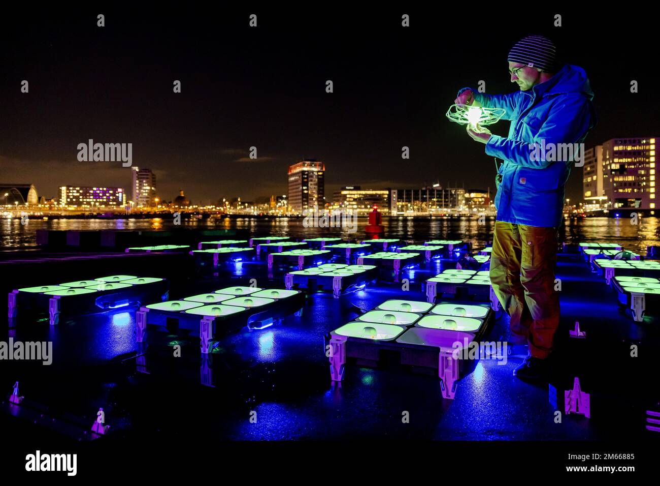 AMSTERDAM - Employees prepare drones for a show with drones and fireworks around the A'DAM Tower, two days after New Year's Eve. The show with six hundred drones was supposed to be held in Amsterdam North on Saturday evening, but was canceled due to bad weather. The municipality of Amsterdam wants to start a new tradition with professional shows for the turn of the year, with less damage, violence and nuisance. ANP ROBIN VAN LONKHUIJSEN netherlands out - belgium out Stock Photo
