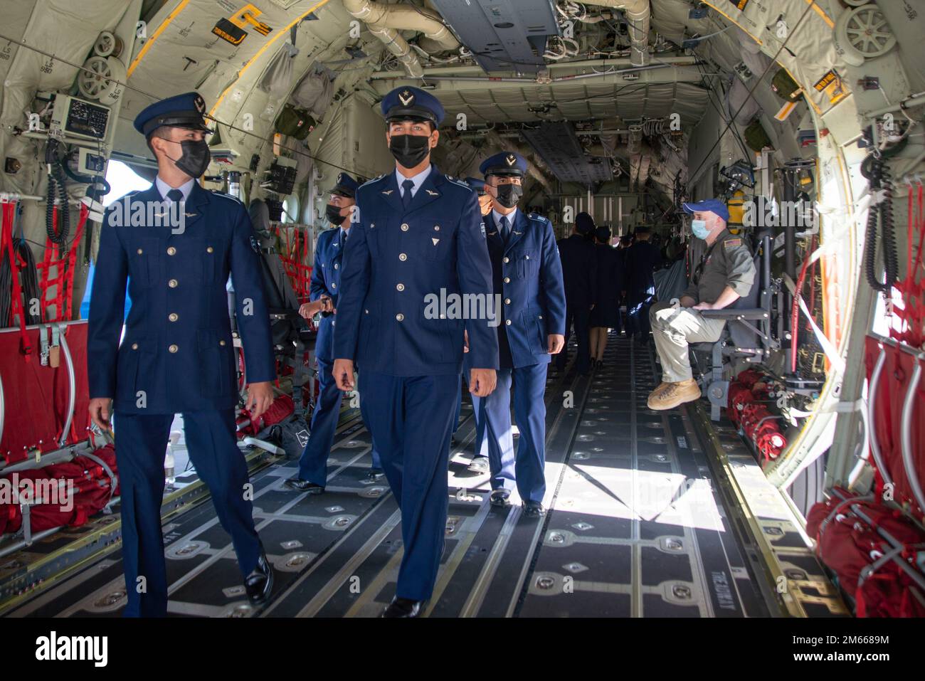 Chilean Escuela Militar cadets tour a static display of a Texas Air National Guard C-130J Super Hercules at Chile’s Feria Internacional del Aire y Espacio (FIDAE) April 6, 2022, in Santiago, Chile. Guardsmen from the 136th Airlift Wing are available to shepherd tours and answer questions throughout the week of the airshow in an effort to strengthen international partnerships. Stock Photo