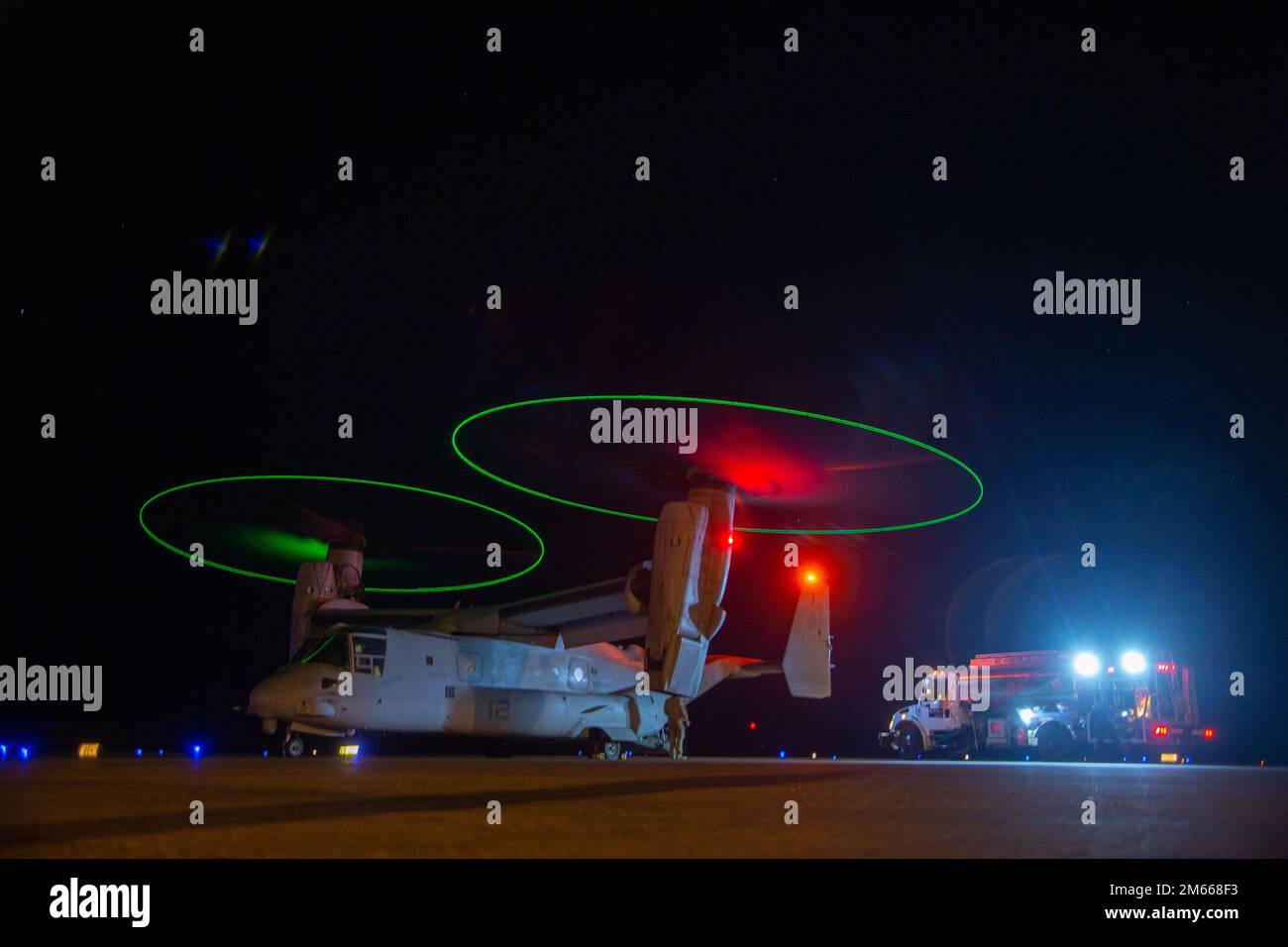 A U.S. Marine Corps MV-22B Osprey with Marine Aviation Weapons and Tactics Squadron One (MAWTS-1), is prepared for takeoff after a refuel during Weapons and Tactics Instructor Course (WTI) 2-22, near Yuma, Arizona, April 6, 2022. WTI is a seven-week training event hosted by MAWTS-1, providing standardized advanced tactical training and certification of unit instructor qualifications to support Marine aviation training and readiness, and assists in developing and employing aviation weapons and tactics. Stock Photo