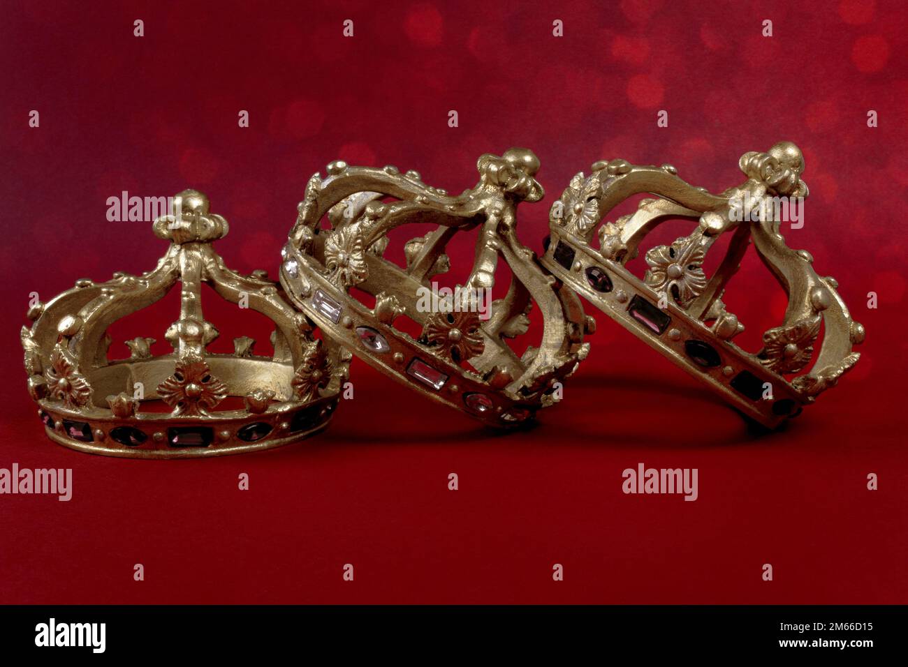 Happy Three King's Day. Three gold crowns on red background. Concept ...