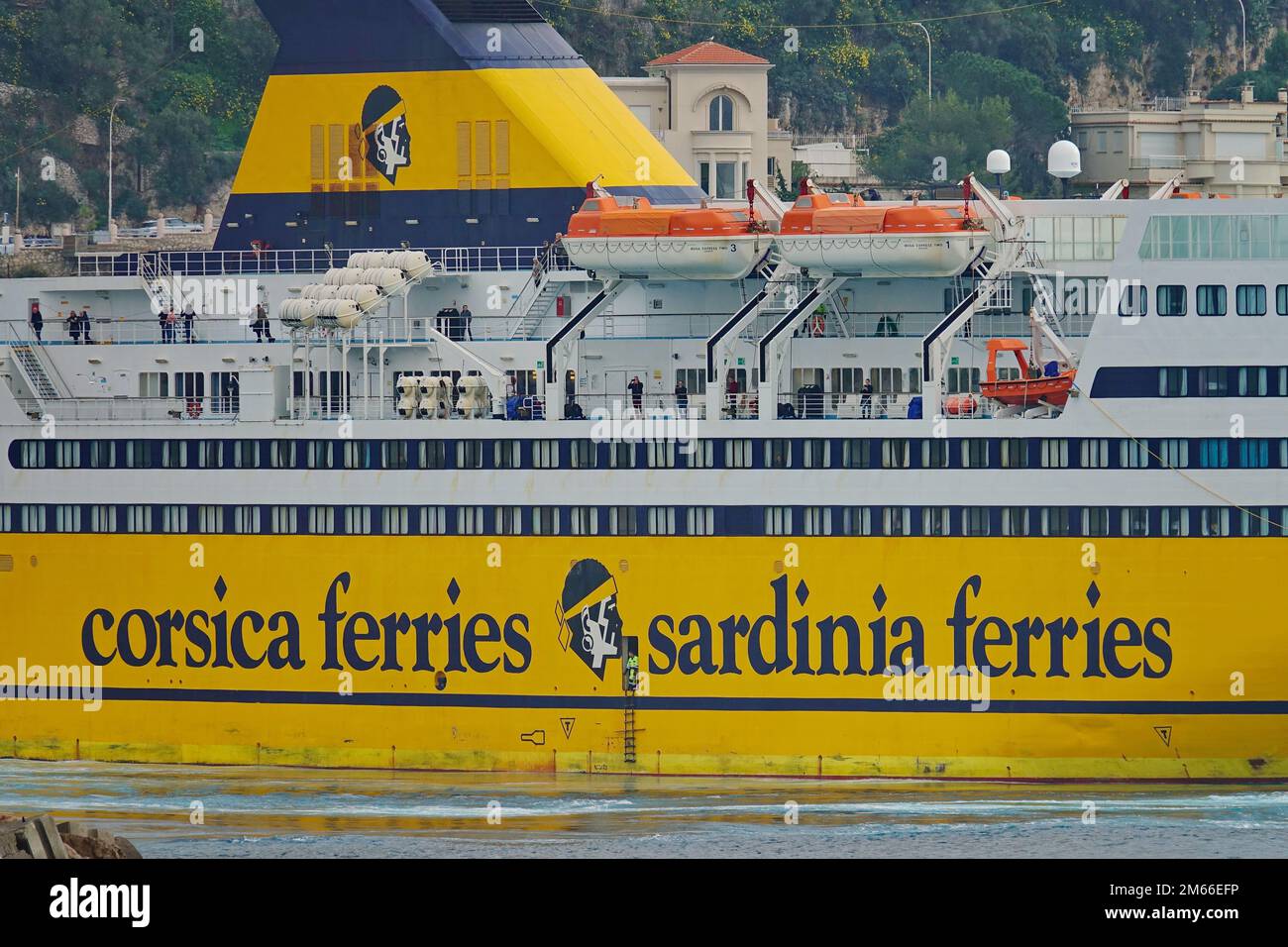 View of a yellow ferryboat Corsica Sardinia Ferries in the Port of Nice harbor. Nice, France - December 2022 Stock Photo
