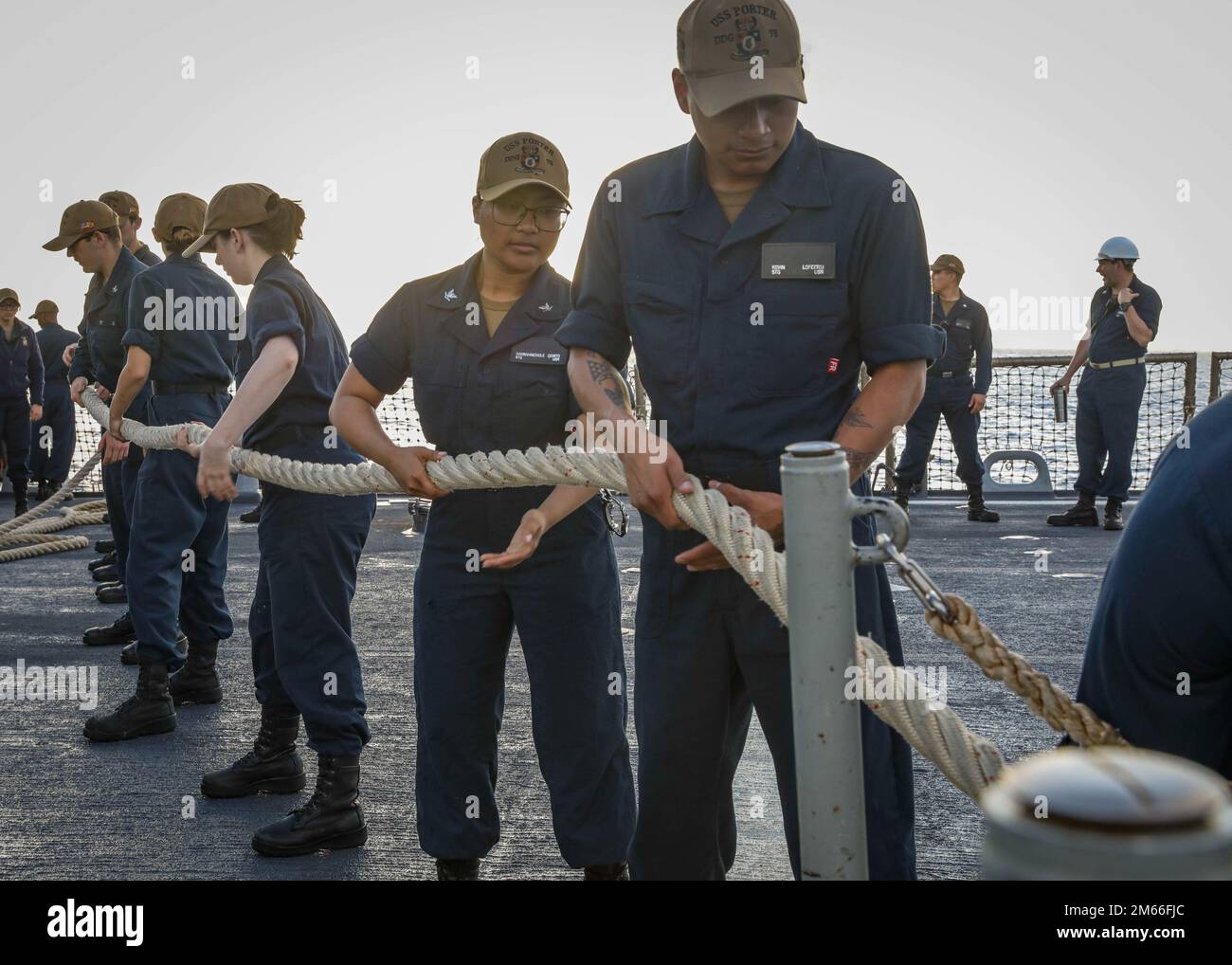 ATLANTIC OCEAN (April 7, 2022) – Sailors stow away mooring lines aboard the Arleigh Burke-class guided-missile destroyer USS Porter (DDG 78), April 7. Porter, forward-deployed to Rota, Spain, is currently in the U.S. 2nd Fleet area of operations to conduct routine certifications and training. Stock Photo