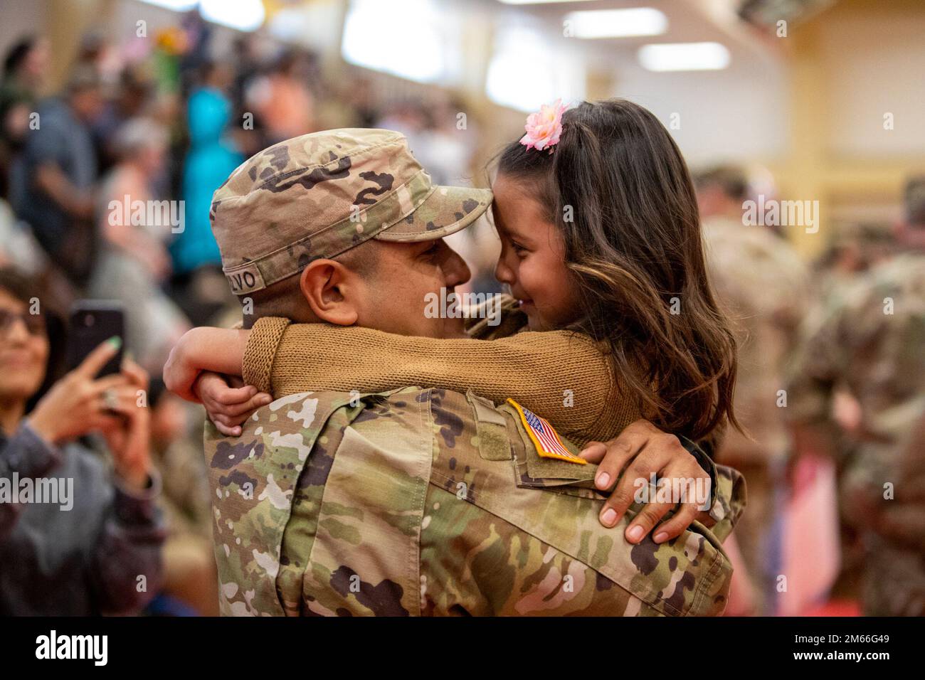 Sgt. Jorge Montalvo hold his daughter Chloe for the first time in nine ...