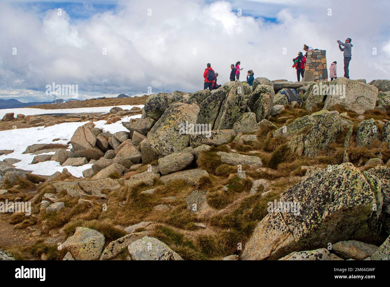 Hikers on the summit of Mt Kosciuszko Stock Photo