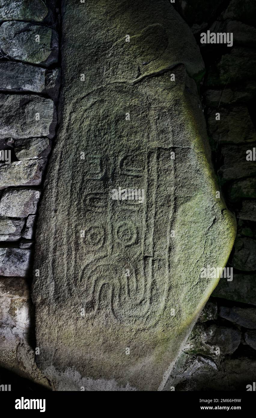 Les Pierres Plates prehistoric Neolithic passage grave. Locmariaquer, Brittany, France. One of the passageway carved stones Stock Photo