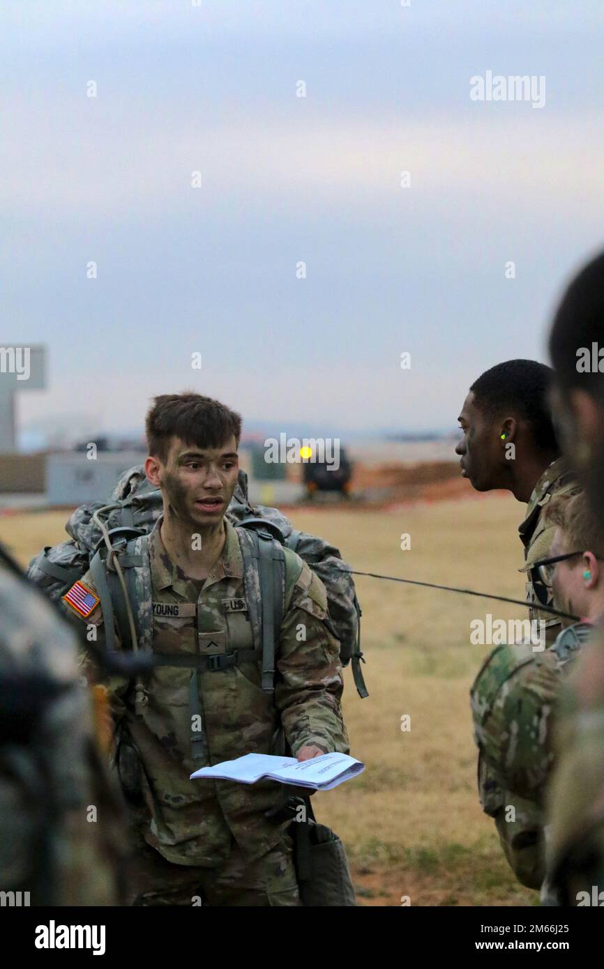 Adam Ruck Pvt. Adam Young briefs his squad on the planned ruck march route before ...