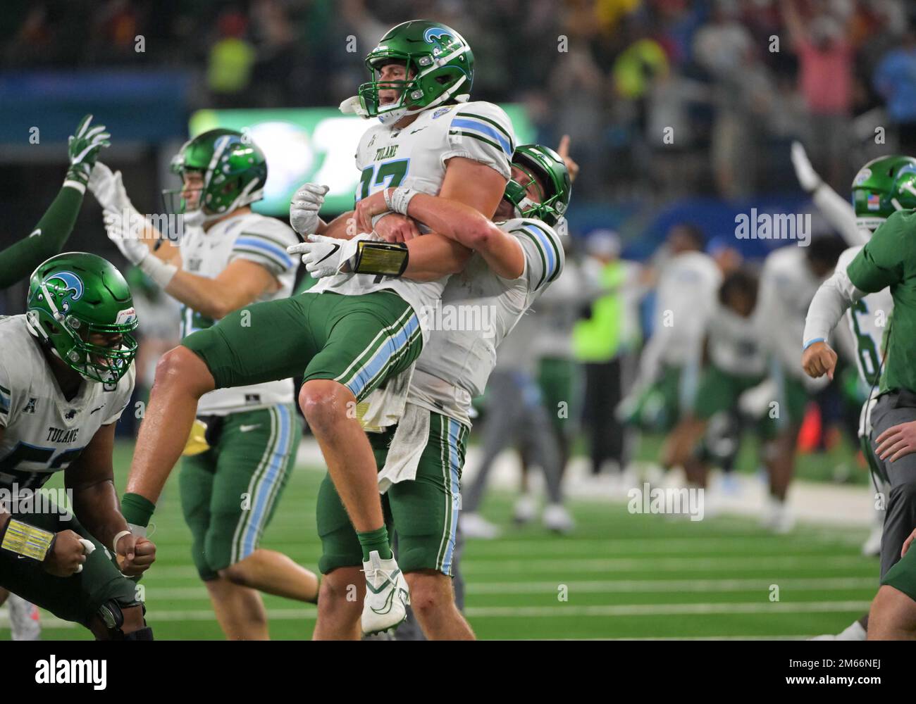 Arlington, Texas, USA. 2nd Jan, 2023. Tulane Green Wave quarterback Michael Pratt (7) and Tulane Green Wave tight end Alex Bauman (87) celebrate a touchdown after review during the 2nd half of the NCAA Football game between the Tulane Green Wave and the USC Trojans at AT&T Stadium in Arlington, Texas. Matthew Lynch/CSM/Alamy Live News Stock Photo