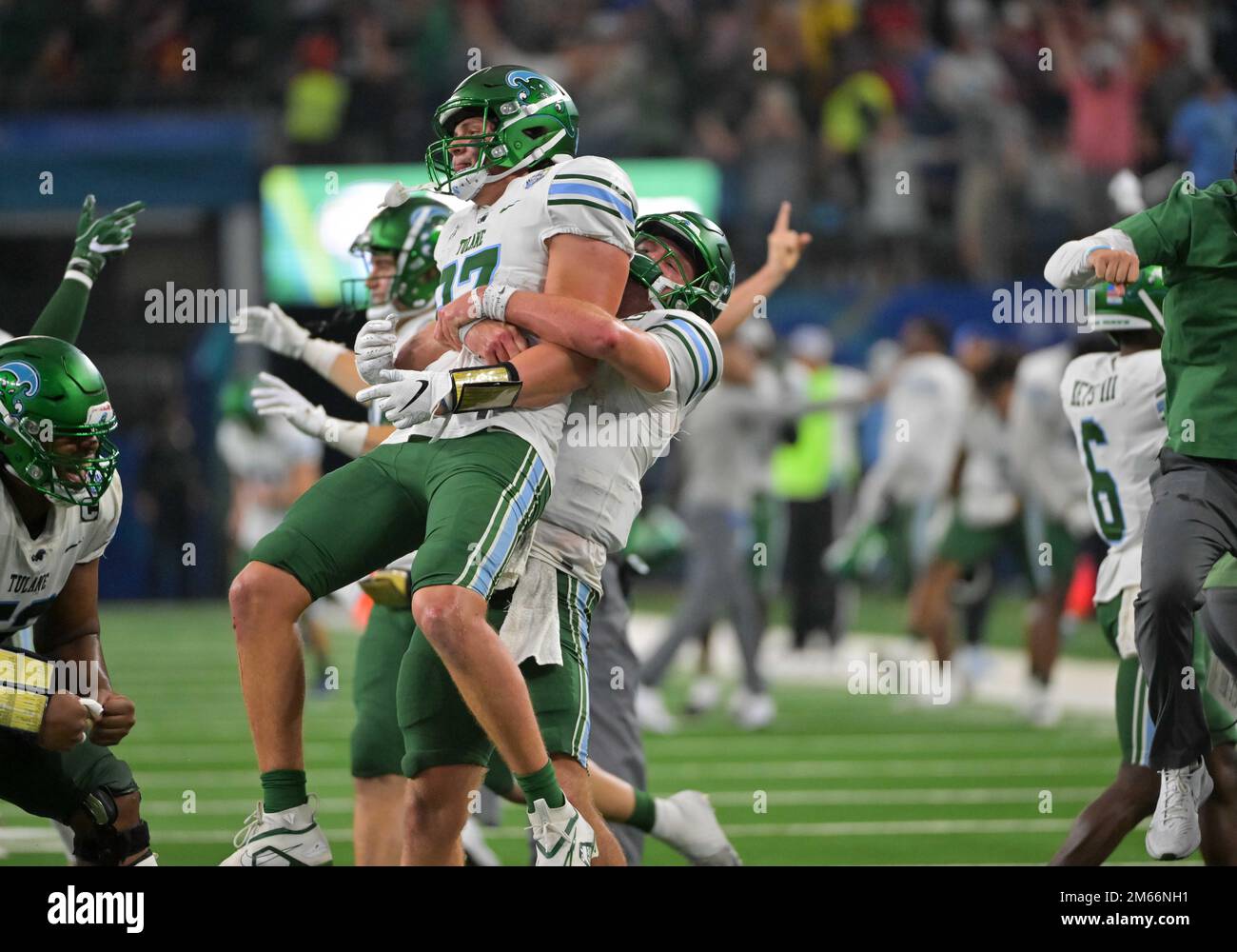 Arlington, Texas, USA. 2nd Jan, 2023. Tulane Green Wave quarterback Michael Pratt (7) and Tulane Green Wave tight end Alex Bauman (87) celebrate a touchdown after review during the 2nd half of the NCAA Football game between the Tulane Green Wave and the USC Trojans at AT&T Stadium in Arlington, Texas. Matthew Lynch/CSM/Alamy Live News Stock Photo