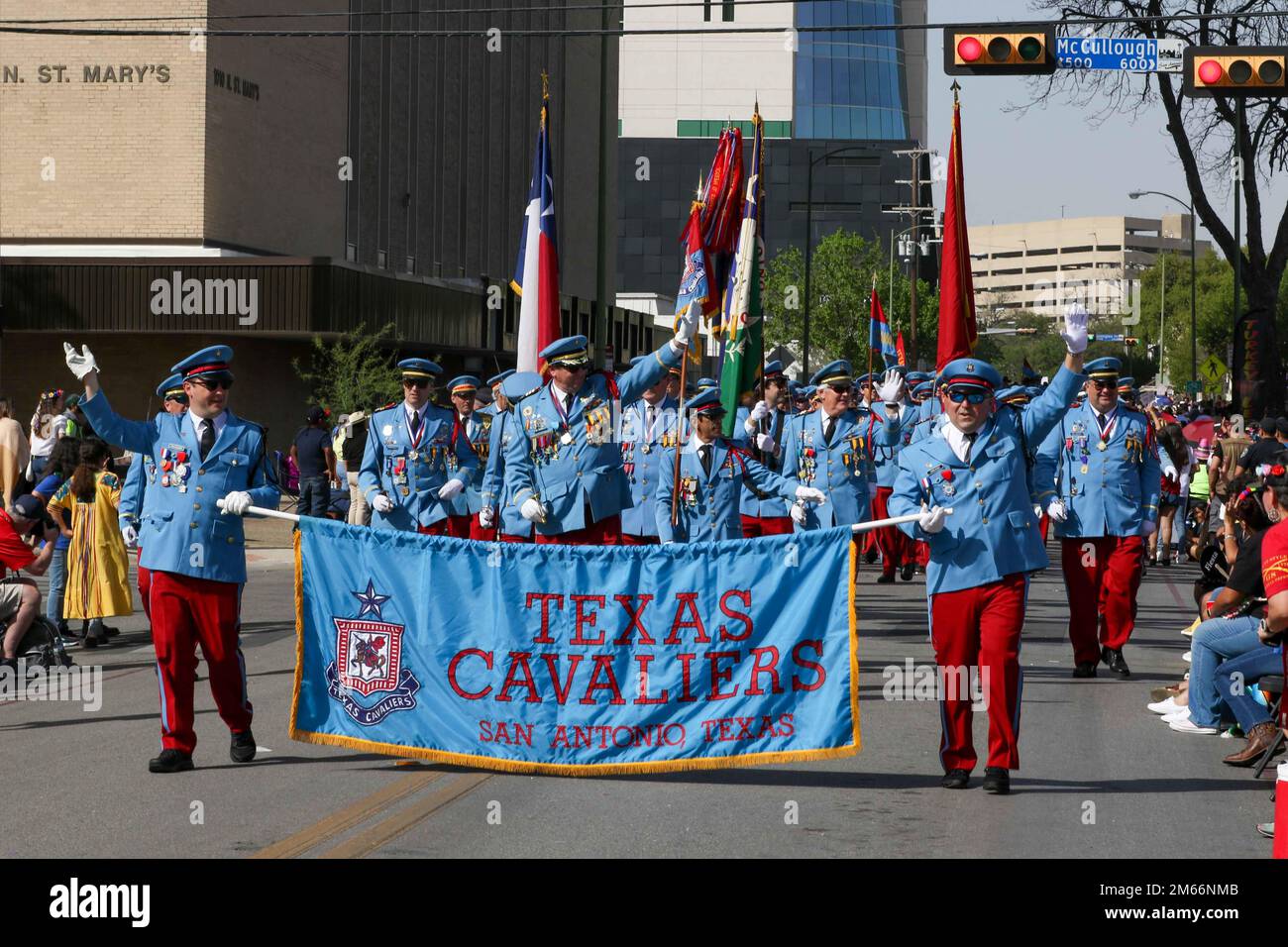 Members of the San Antonio Texas Cavaliers march during the Battle of