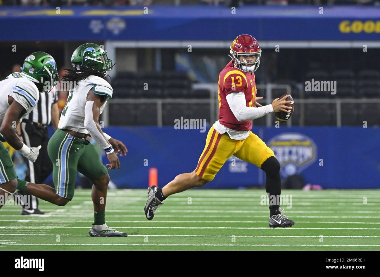 Arlington, United States. 02nd Jan, 2023. USC's Caleb Williams gets chased by Tulane defenders in the 2023 Goodyear Cotton Bowl Classic on Monday, January 2, 2023 at AT&T Stadium in Arlington, Texas. Tulane defeated USC 46-45. Photo by Ian Halperin/UPI Credit: UPI/Alamy Live News Stock Photo