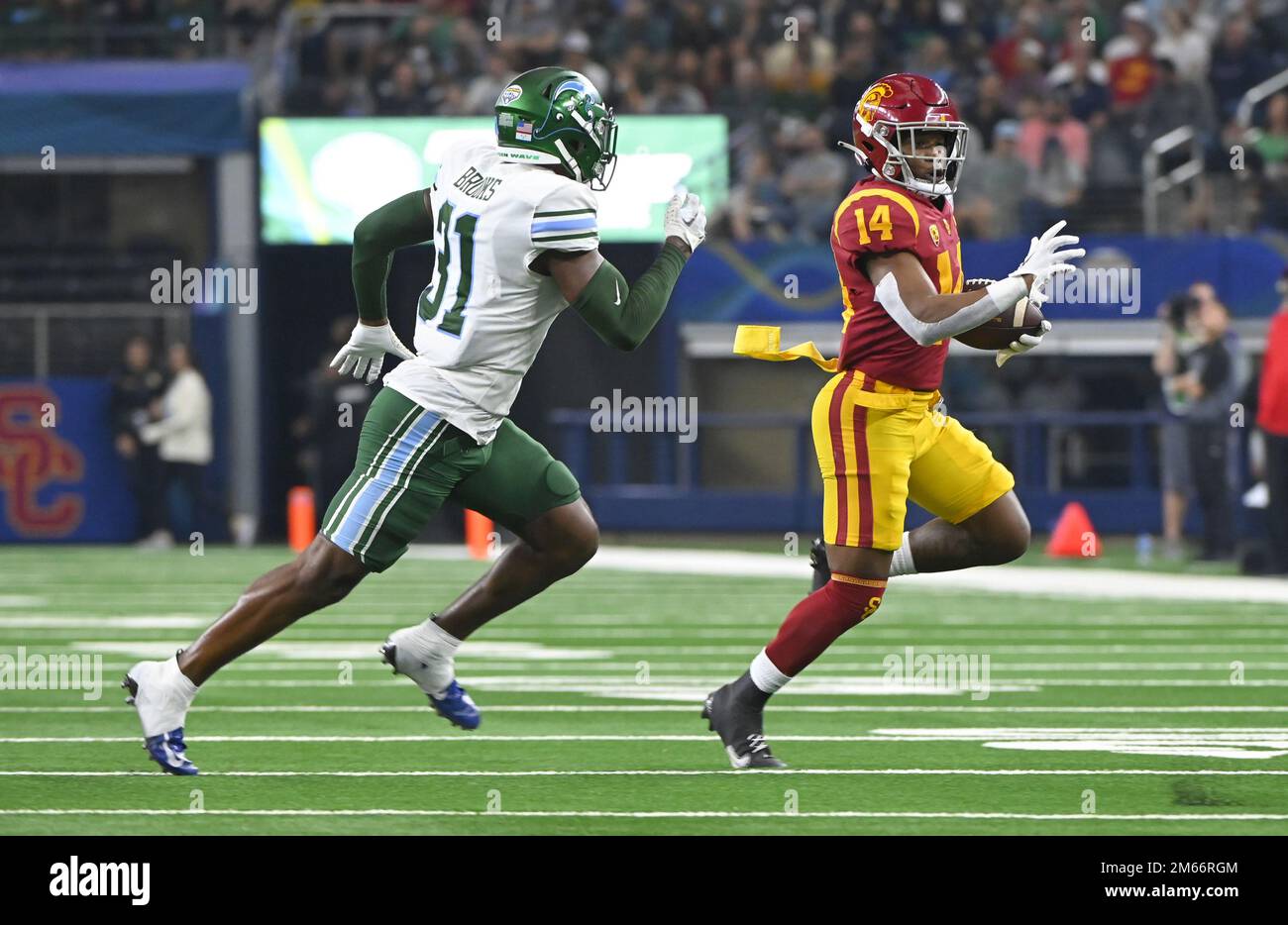 Arlington, United States. 02nd Jan, 2023. Tulane's Larry Brooks pursues USC's Raleek Brown in the 2023 Goodyear Cotton Bowl Classic on Monday, January 2, 2023 at AT&T Stadium in Arlington, Texas. Tulane defeated USC 46-45. Photo by Ian Halperin/UPI Credit: UPI/Alamy Live News Stock Photo