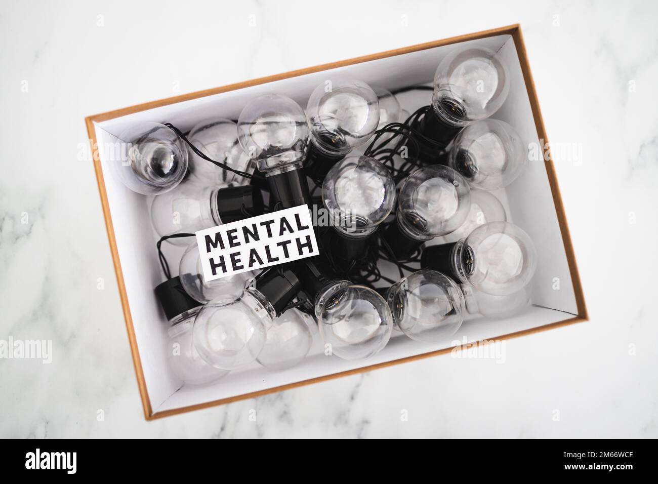 mental health text in box over group of light bulbs, psychology concept Stock Photo