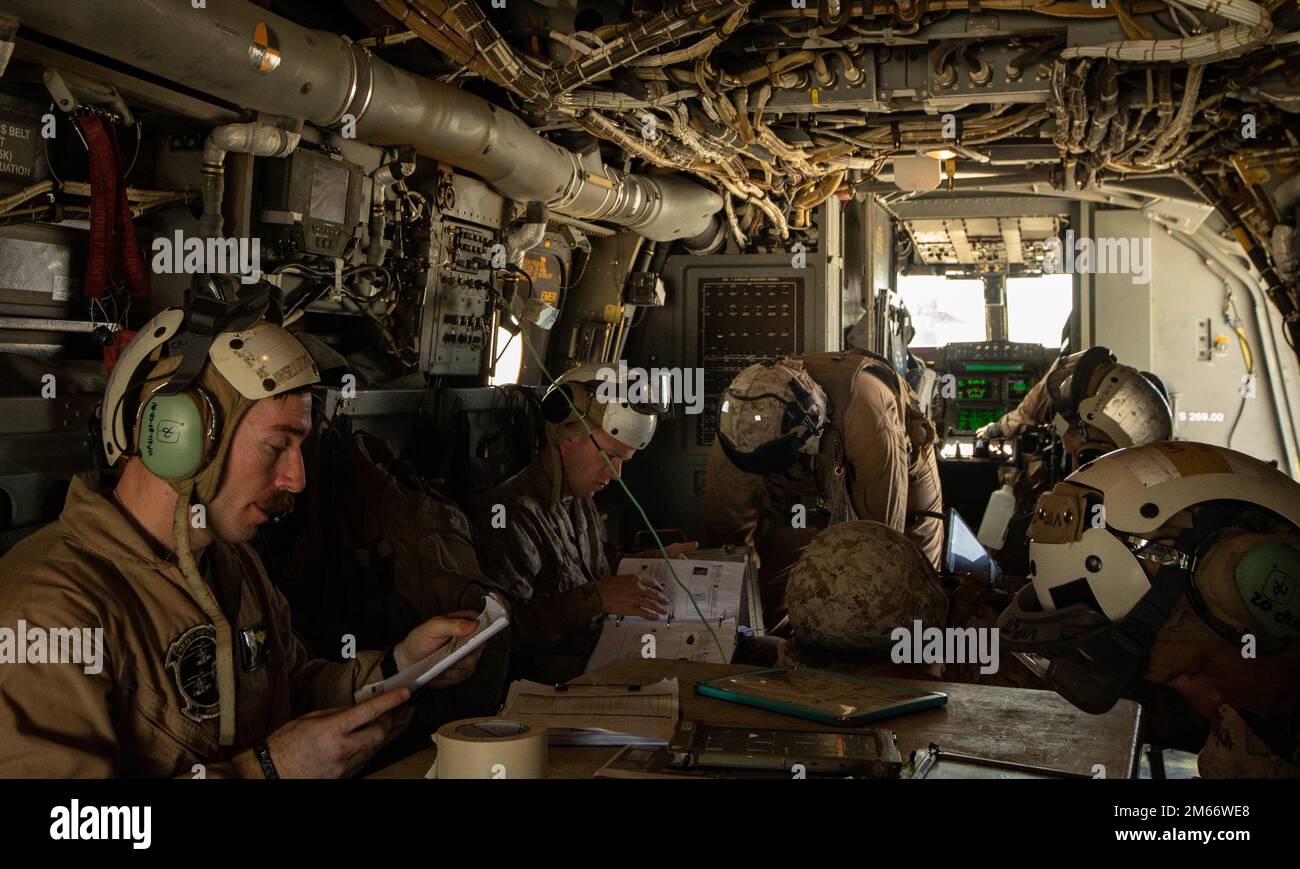 U.S. Marines assigned to Marine Aviation Weapons and Tactics Squadron One (MAWTS-1), conduct planning aboard an MV-22B Osprey during Weapons and Tactics Instructor (WTI) course 2-22, at Marine Corps Air Station Yuma, Arizona, April 08, 2022. WTI is a seven-week training event hosted by MAWTS-1, providing standardized advanced tactical training and certification of unit instructor qualifications to support Marine aviation training and readiness, and assists in developing and employing aviation weapons and tactics. Stock Photo