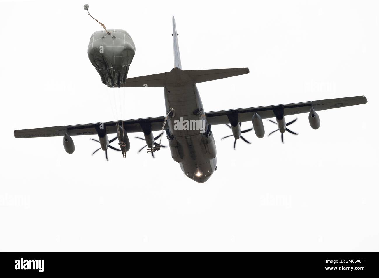 U.S. Army paratroopers assigned to the 2nd Infantry Brigade Combat Team (Airborne), 11th Airborne Division, “Arctic Angels,” jump from a U.S. Marine Corps KC-130J Super Hercules during airborne operations over Malemute Drop Zone at Joint Base Elmendorf-Richardson, Alaska, Oct. 7, 2022. The aircrew and aircraft were assigned to Marine Aerial Refueler Transport Squadron 152 out of Marine Corps Air Station Iwakuni, Japan. The Arctic Angels stay proficient at their primary function of being a Joint Forcible Entry unit, able to respond and project power across the Pacific within 18 hours. (U.S. Air Stock Photo