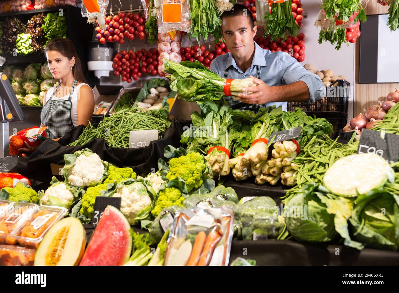 Man selling fruits and vegetables Stock Photo - Alamy