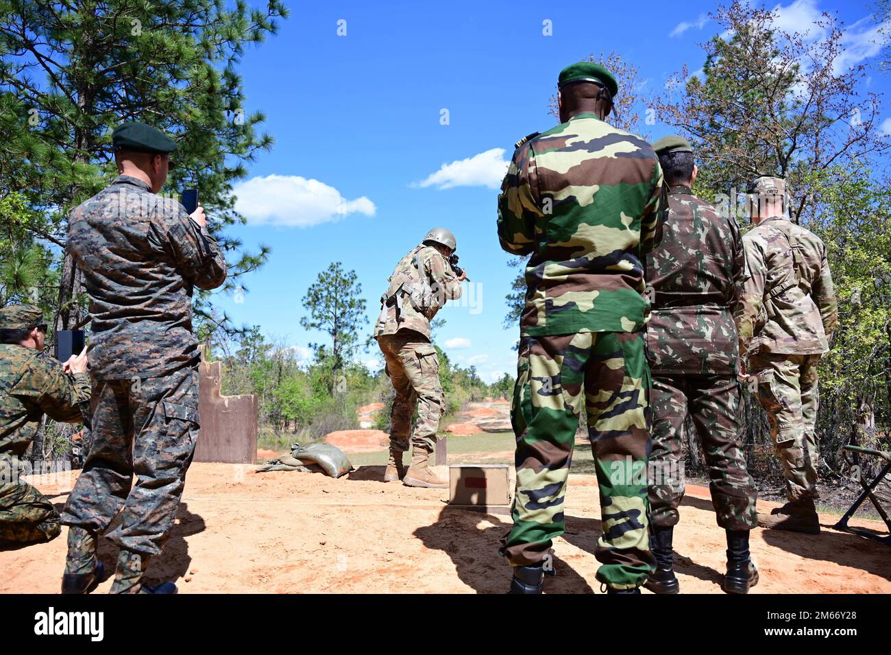 Foreign military attachés from across the globe watch Solders fire the ...