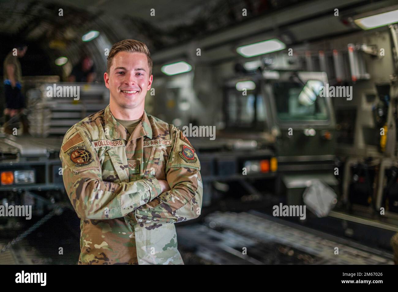 U.S. Air Force Senior Airman Austin Wollenberg, 60th Aerial Port Squadron air transportation specialist, poses for a photo on a C-17 Globemaster III assigned to Joint Base Lewis-McChord, Washington, at Travis Air Force Base, California, March 8, 2022. Wollenberg served as the team chief lead overseeing the cargo transportation in support of an F-35C Lighting II recovery mission. Stock Photo