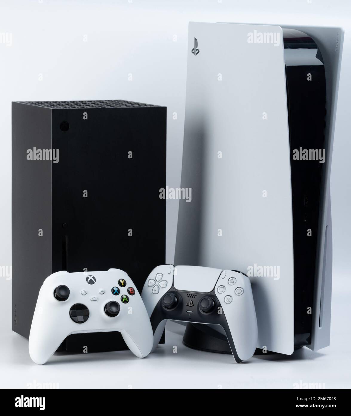 New york, USA - December 28, 2022: Next generation game consoles Microsoft  xbox and sony playstation with game pads isolated on white studio backgroun  Stock Photo - Alamy